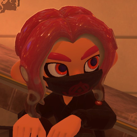 A male light skinned Octoling from Splatoon with the Octolocks hairstyle and wearing an Annaki Facemask. The photo was taken at sunset.